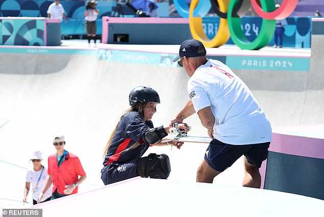 She was helped up to the top of the course after her run, ahead of the final later today