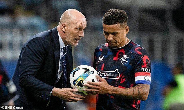 Rangers boss Philippe Clement gives instructions to captain Tavernier