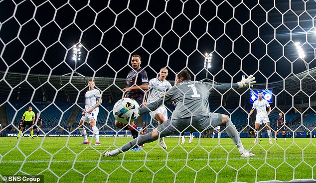 Rangers striker Dessers knocks the ball past Dynamo goalkeeper Bushchan