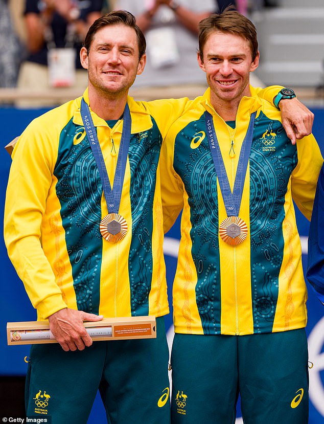 Australia is the world benchmark when it comes to the best Olympic country per capita based on medal tally (pictured, tennis stars Matthew Ebden and John Peers after winning gold in doubles)