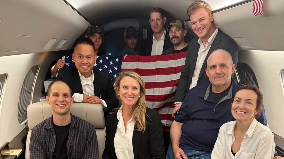 This image released by the White House shows Evan Gershkovich, Alsu Kurmasheva, and Paul Whelan on a plane