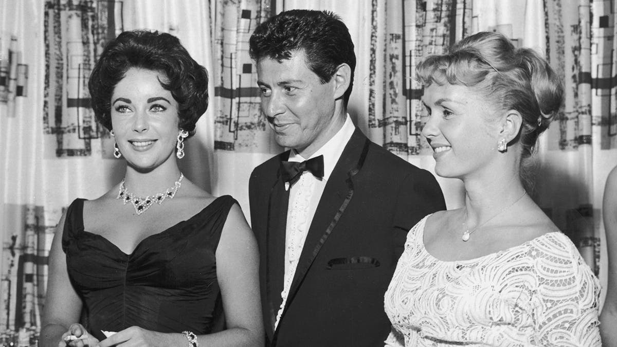 Eddie Fisher poses with Elizabeth Taylor and Debbie Reynolds.