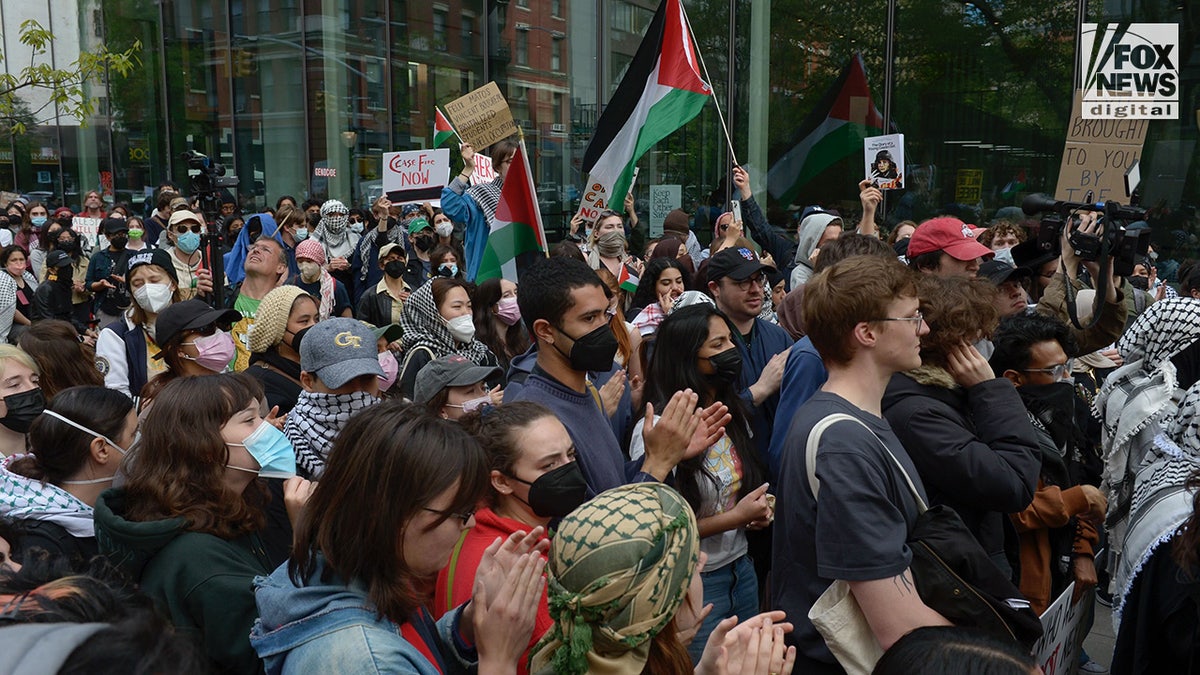 Protesters rally outside of New York University