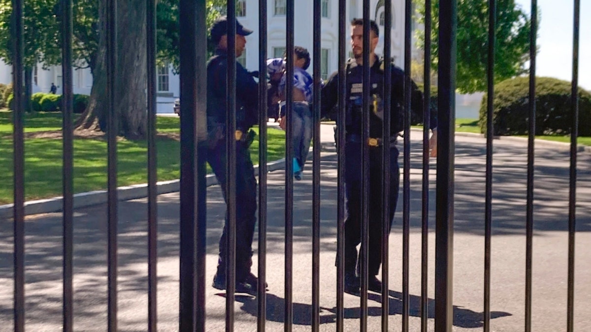 Secret Service officers assisting a child