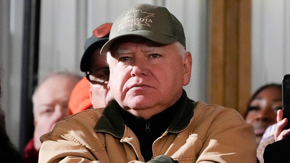 Minnesota Governor Tim Walz listens while President Joe Biden speaks