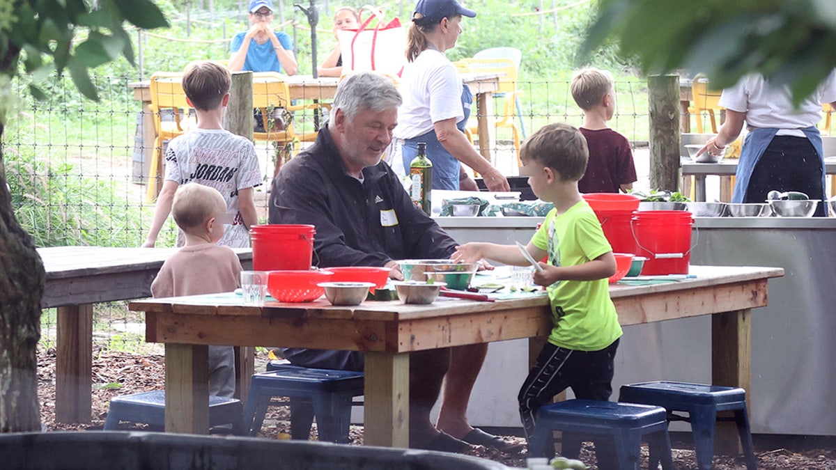 Alec Baldwin enjoys playtime at a park with his children in the Hamptons.