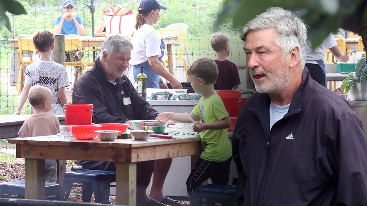 Alec Baldwin wearing an Adidas coat while filming a TLC show with his children.