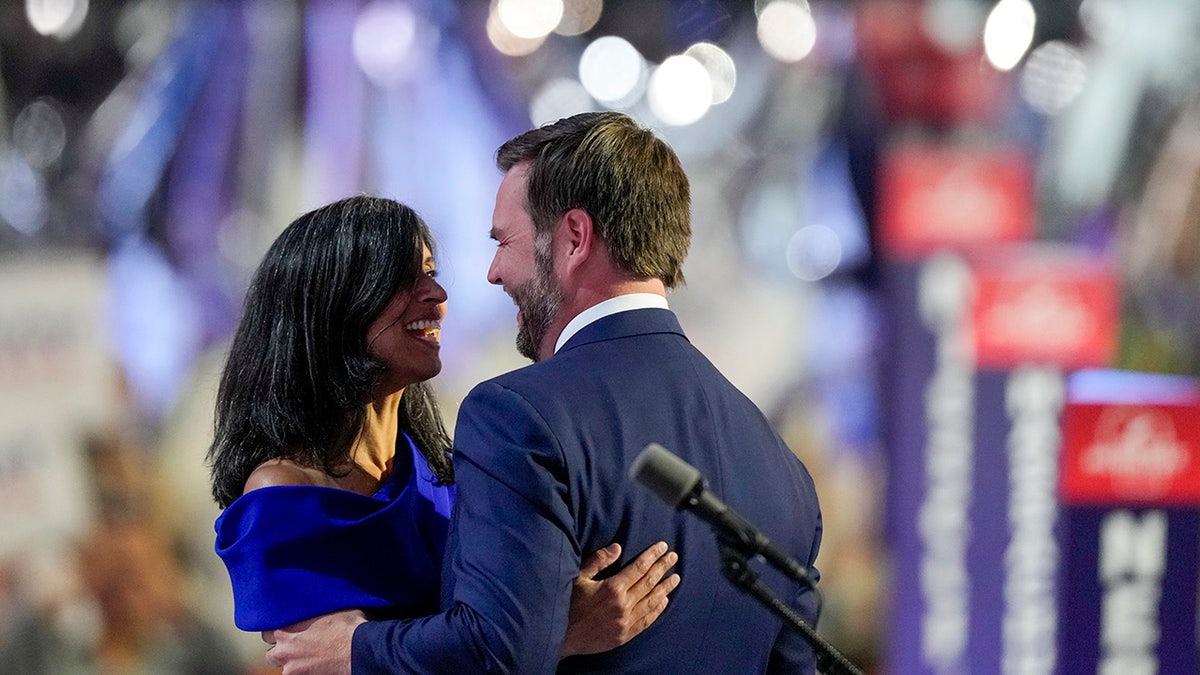 Republican vice presidential candidate Sen. JD Vance embraces his wife Usha Chilukuri Vance