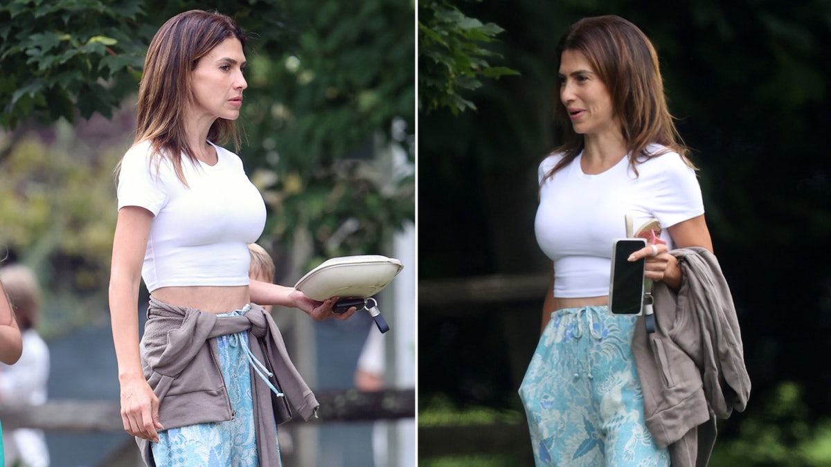 Hilaria Baldwin flaunts her physique in a crop top and pants during filming.