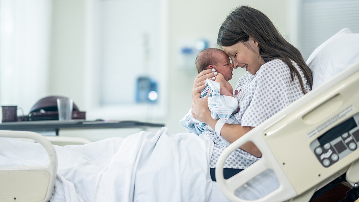 New mother cherishes her newborn shortly after birth