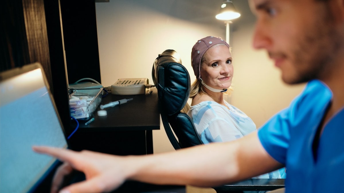 Woman undergoing an EEG